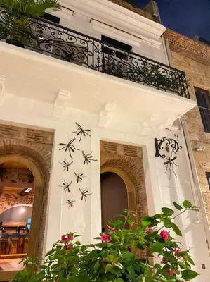 a building with stars painted on the side of it at Mosquito Boutique Hotel Zona Colonial in Santo Domingo