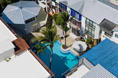 an overhead view of a swimming pool next to a building at Studio Apartment Center of Sosua Remote Worker Space Fast WiFi in Sosúa