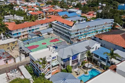 an overhead view of a building with a tennis court at Studio Apartment Center of Sosua Remote Worker Space Fast WiFi in Sosúa