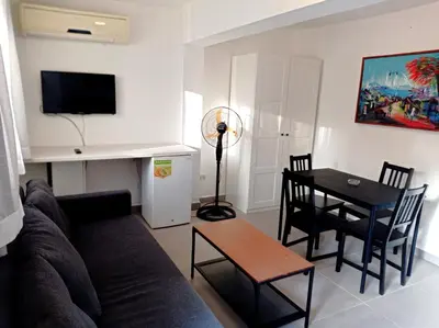 a living room with a couch and a table at Hotel Casa Coco in Boca Chica