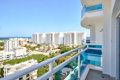 a balcony with a view of a city at Sunset View 2BR Apartamento Juan Dolio Las Velas in Juan Dolio