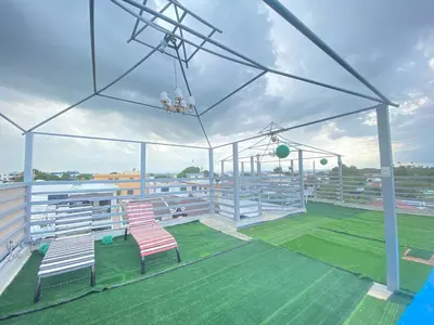a baseball field with two chairs on a field at 6A Cozy Apt in Santiago Center - Great Stay in Santiago de los Caballeros