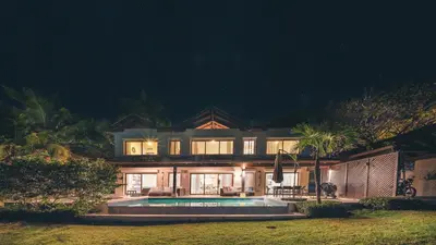a large house with a swimming pool at night at Luxurious Villa at Puerto Bahia with Great Views in Los Grini