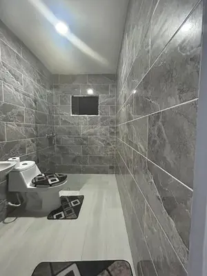 a bathroom with a toilet and a sink at Hotel Sol Azul in La Romana