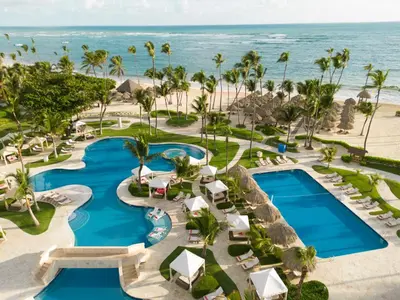 an aerial view of the pool at the excellence punta cana resort at JOIA Bavaro by Iberostar - Adults Only All Inclusive Resort in Punta Cana