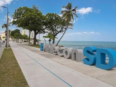 a sign that says sony on the side of a beach at Malecon Cozy Private Room in Santo Domingo