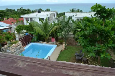 an aerial view of a backyard with a swimming pool at ECOVILLA CORAL GARDEN in Baoruco