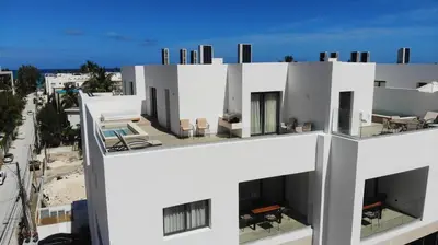 a white building with a view of a street at Hermoso Penthouse a solo pasos de la Playa in Punta Cana