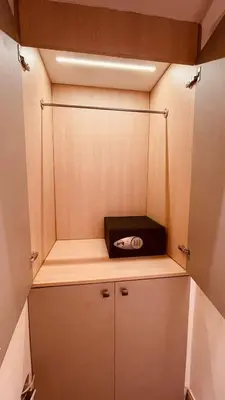 a small cabinet with a toaster on top of it at Hotel La Colonia in Santo Domingo