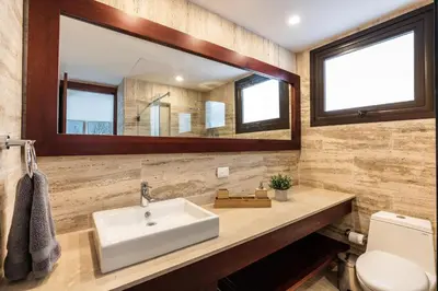 a bathroom with a sink and a mirror at 3BR apartment with balcony in Portillo - Terrenas in Abra Grande