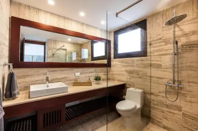 a bathroom with a toilet and a sink and a shower at 3BR apartment with balcony in Portillo - Terrenas in Abra Grande