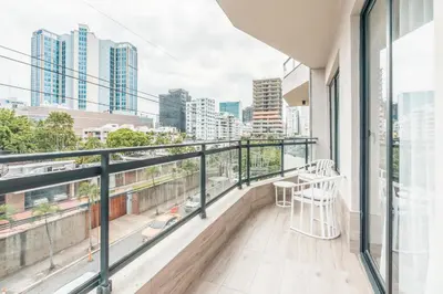 a balcony with a view of the city at Fully Serviced Apartment at Regatta Living II - 302 in Santo Domingo
