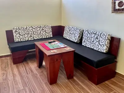 a living room with a couch and a table at Hotel Maria Bonita Higüey in Higuey