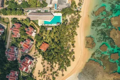 an aerial view of a beach with houses and trees at Special Price Deluxe 2BR at El Portillo in Las Terrenas