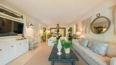 a living room with a couch and a table at Special Price Deluxe 2BR at El Portillo in Las Terrenas