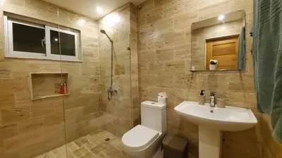 a bathroom with a toilet and a sink and a shower at Samán Residences D3 in Las Terrenas
