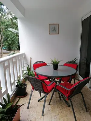 a patio table and chairs on a balcony at Apartment Monocal in Boca Chica in Boca Chica