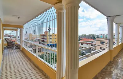 a balcony with a view of the city at 2 Bedroom 2 Bathroom Apartment- Corales del Sur Ole Las Americas- Isabelita in La Viva