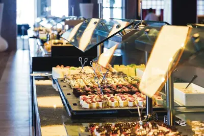 a buffet with many different types of food on display at Riu Republica - Adults Only - All Inclusive in Punta Cana