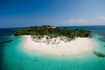 an island in the ocean with people on it at Private room in the Boca Chica Resort condominium in Boca Chica
