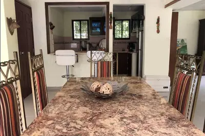 a kitchen with a table with a bowl on it at Acogedora Casa Rural en plena naturaleza frente al Río con piscina Bonao in Bonao
