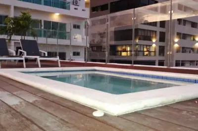 a swimming pool on the roof of a building at Escape Apartments, Balcony, Pool & Gym in La Julia in Santo Domingo