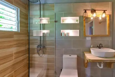 a bathroom with a toilet and a sink and a shower at Casa Kafe in Cabrera