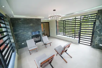a living room with two chairs and a fireplace at Villa segur-a vicente in Concepción de La Vega