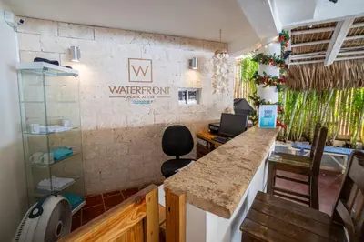 an office with a counter and a water room sign on the wall at Bungalow #10 at Waterfront Playa Alicia in Sosúa