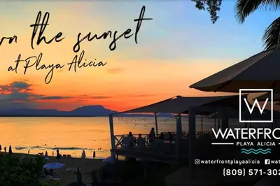 an image of a sunset at a beach at Bungalow #12 at Waterfront Playa Alicia in Sosúa