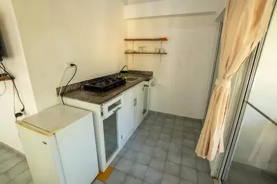 a kitchen with a stove and a counter top at Bungalow #17 at Waterfront Playa Alicia in Sosúa