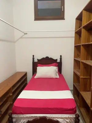 a bedroom with a bed with a red and white blanket at Ocean Breeze Villa Carismar in Cabrera