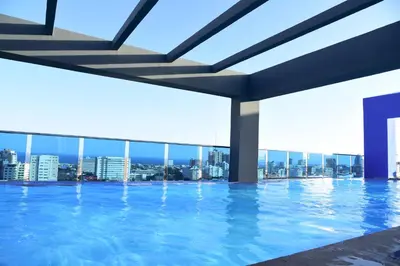 a swimming pool with a view of the city at N1401 Espectacular vista Downtown Santo Domingo RD in Santo Domingo