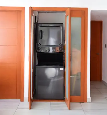 a television sitting on top of a refrigerator at N1401 Espectacular vista Downtown Santo Domingo RD in Santo Domingo