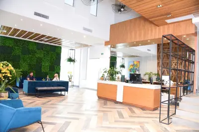 a lobby with people sitting at a desk in a building at N1401 Espectacular vista Downtown Santo Domingo RD in Santo Domingo