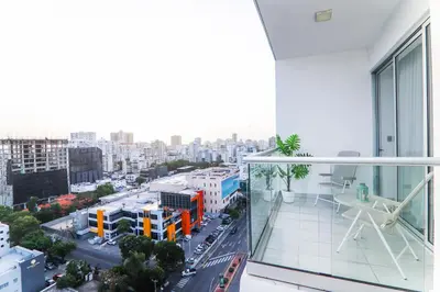 a balcony with a view of a city at S1401 La mejor vista Downtown Santo Domingo RD in Santo Domingo