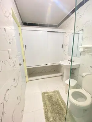 a bathroom with a toilet and a sink at TriRoom Apartment SANTO DOMINGO ESTE in Santo Domingo