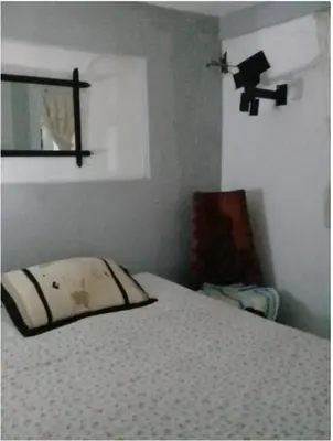 a bedroom with a bed with a pillow on it at Villa Julirous Rd 2 bedrooms apartment in Boca Chica