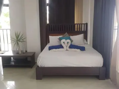 a bedroom with a bed with a stuffed octopus on it at Estudio Frente al Mar Solo Adultos in La Laguna