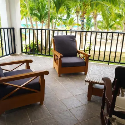 a porch with chairs and a balcony with palm trees at Estudio Frente al Mar Solo Adultos in La Laguna