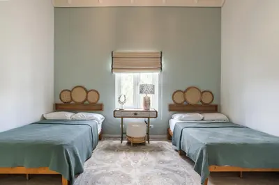 a room with two twin beds and a window at Newly Added El Portillo 2BR Apt in Abra Grande