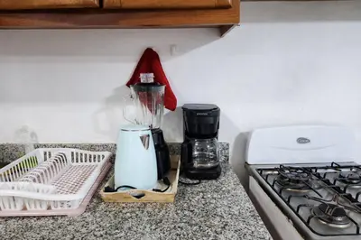 a blender sitting on a counter next to a stove at Sol Dominicus 1 Apartamento con Cocina Solo Adultos in La Laguna