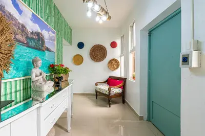 a hallway with a large painting on the wall at Bamboo Hoouse in Santo Domingo
