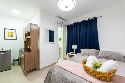 a bedroom with a bed with a basket on it at Bamboo Hoouse in Santo Domingo