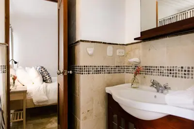 a bathroom with a sink and a mirror at Punta Cana 2 Bedr. up to 6 guests 1 mile to Beach in Punta Cana