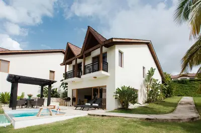 a villa with a swimming pool and a house at Ocean View Villa/Luxury Puerto Bahia Resort/Samaná in Santa Bárbara de Samaná