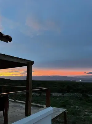 a sunset from the balcony of a house at Altos de la Caobita in Barreras