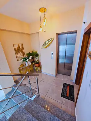 a lobby with a staircase and a glass door at Self-checking-Fast internet-Alexa-Smart-Tv-AC-Hot Water in Ensanche Ozama