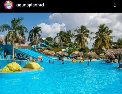 a group of people in a pool at a resort at Self-checking-Fast internet-Alexa-Smart-Tv-AC-Hot Water in Ensanche Ozama