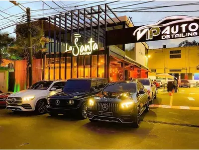 a group of cars parked in front of a store at Self-checking-Fast internet-Alexa-Smart-Tv-AC-Hot Water in Ensanche Ozama